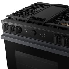 a black stove top oven with two burners and an electronic timer on the front