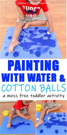 a boy is painting with water and cotton balls on a blue mat, while another child sits in front of him