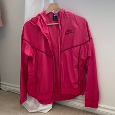 Never Worn. In Perfect Condition Spring Nike Track Jacket With Pockets, Nike Pink Sports Outerwear, Nike Spring Sports Outerwear, Nike Athleisure Outerwear For Spring, Nike Pink Long Sleeve Windbreaker, Nike Spring Sportswear Outerwear, Nike Sportswear Outerwear For Spring, Pink Nike Windbreaker, Nike Windbreaker