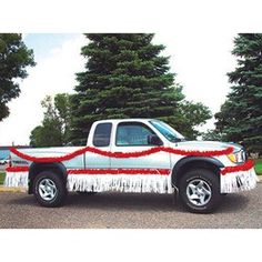 a white truck with red and white decorations on it