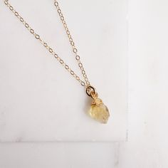 Citrine necklace - November Birthstone Necklace - Citrine Jewelry - Citrine Birthstone - Born in November - Mother's Day Jewelry - Dainty From our collection of natural raw birthstone necklaces. The Citrine is November's birthstone. Because of the natural raw origin of our stones, all these necklaces are unique and the shape and size of the stone will vary slightly from the one in the photos. Chain: 14k gold filled Clasp: Spring Ring Length: 16 inches Stone: Raw natural Citrine Stone: 9mm x 7mm Teardrop Birthstone Jewelry For Healing, Healing Birthstone Teardrop Jewelry, Birthstone Crystal Necklace For Gift, Delicate Healing Birthstone Jewelry, Delicate Birthstone Crystal Necklace For Everyday, Delicate Everyday Birthstone Crystal Necklace, Everyday Amber Birthstone Jewelry, Everyday Amber Jewelry Birthstone, Delicate Birthstone Crystal Necklace