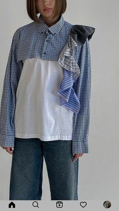 a woman wearing a blue and white checkered shirt