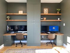 a home office with two desks and shelves