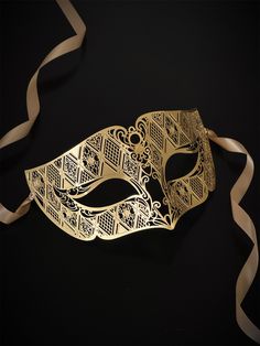 Our laser-cut metal mask boasts a stunning gold finish that shines and shimmers, ensuring you stand out in any crowd. Crafted with your comfort in mind, our mask is lightweight and easy to wear for hours on end.


Age Group/Gender - Adult/Men

Size/Type - One size fits all adults

Mask Color - Gold

Mask Material - Laser cut metal Elegant Gold Mask For Masquerade, Gold Masks For Evening Carnival, Gold Carnival Masks For Evening, Gold Eye Mask For Carnival, Elegant Gold Eye Mask For Masquerade, Elegant Gold Mask For Carnival, Elegant Gold Masks For Carnival, Elegant Gold Eye Masquerade Mask, Elegant Gold Carnival Mask