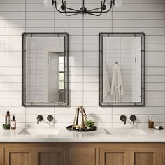 a bathroom with two sinks and mirrors on the wall above them is shown in this image