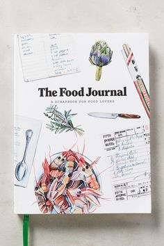 the food journal is sitting on top of a table