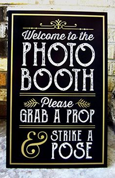 a sign that says welcome to the photo booth please grab a prop and strike a pose