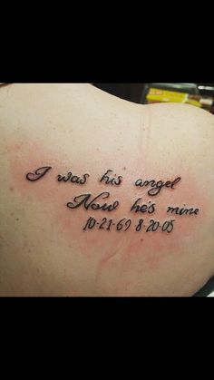 a woman's back with a tattoo saying i was his angel now he's mine