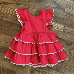 Red Patpat Spanish-Style Frilly Festive Girl Dress Size 12-18m. Nwt. 100% Cotton. Featuring Adorable Bow Tie Back And Tiered Layers. White Lace Frill Lines Layers. Perfect For Parties. Cute Red Holiday Dress For Dress-up, Spring Holiday Dress With Ruffles, Cute Red Ruffled Dress, Cute Red Holiday Dress, Cute Red Dress With Ruffles, Red Ruffled Dresses For Playtime, Cute Red Dress For Dress-up Occasions, Red Cotton Dress For Play, Red Cotton Casual Dress