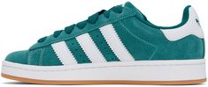 Low-top suede and buffed leather sneakers in green. · Lace-up closure · Logo embossed at padded tongue and heel tab · Padded collar · Text embossed at outer side · Perforated detailing and signature serrated stripes at sides · Terrycloth lining · Treaded rubber sole Supplier color: Legacy teal/Cloud white/Gum Green Adidas Skate Shoes For Skateboarding, Green Suede Skate Shoes With Round Toe, Green Suede Round Toe Skate Shoes, Green Leather Skate Shoes With Rubber Waffle Outsoles, Green Suede Skate Shoes With Gum Sole, Green Suede Skate Shoes For Streetwear, Green Leather Skate Shoes With Vulcanized Sole, Green Leather Skate Shoes, Green Leather Skate Shoes For Skateboarding