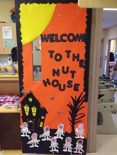 a door decorated to look like an outer space theme with the words welcome to the nut house