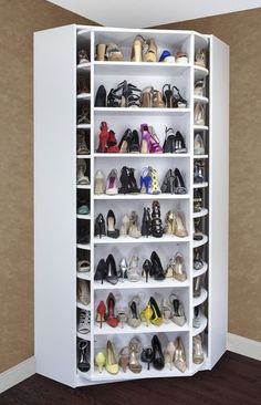 a white closet filled with lots of shoes