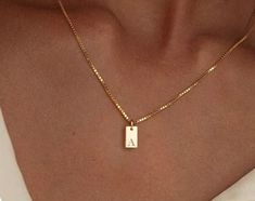 ✨ Elevate your style with our Elegant Rectangle Initial Necklace, designed for both women and men! This chic gold choker features a single letter detail, making it a perfect personalized accessory for 2024. Crafted from shimmering cubic zirconia, it's not just jewelry; it's a statement! 💖 Pendant Size: As pictured Style: Trendy Material: Copper Alloy Chain Type: Link Chain 🎁 Whether it's for an anniversary or a special occasion, this necklace is the ideal gift for anyone who loves unique and stylish pieces. Wear it alone or layer it for a trendy look that speaks to your personality! Choker Pendant, Single Letter, Gold Choker, Statement Pendant, Personalized Accessories, Necklace For Women, Name Necklace, Initial Necklace, Link Chain