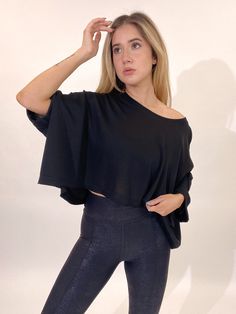 Feelin' Fit in this outfit. Soft and flowy, this top is a great closet staple. Pair with leggings and you will slay this everyday look. Model Info Model is 5’6 and wearing size: SMALL Model measurements: Bust: 36 in. Waist: 33 in. Hips: 41.5 in. Size Chart GENERAL SIZE CHART: 00-EXTRA SMALL, 0-2 SMALL, 4-6 MEDIUM, 8-10 LARGE, 12-14 EXTRA LARGE Each item runs differently therefore there is not a size chart that will be certain for every person. Please note: the product description will state if i Chic Oversized Tops For Loungewear, Flowy Short Sleeve Tops For Loungewear, Trendy Batwing Sleeve Tops For Loungewear, Trendy Loungewear Tops With Batwing Sleeves, Trendy Batwing Sleeve Loungewear Top, Stretch Tops For Loungewear, Versatile Stretch Tops For Loungewear, Black Activewear For Fall Night Out, Oversized Edgy Tops For Fall