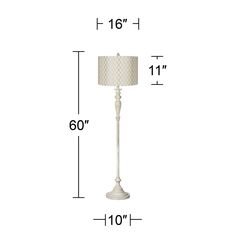 a white floor lamp with measurements for the base and fabric shade on it's side