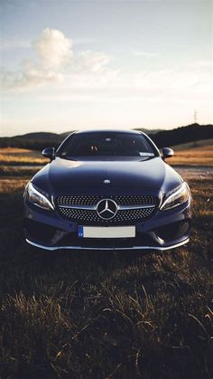 a car parked in the middle of a field