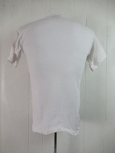 "Vintage 1980s vacation travel t shirt. Made of white cotton. has multi color graphics with sun, surf, palm trees and sailboat. Reads: Diamond Hotel and Resorts Playacar. Size medium. Actual measurements are: 35\" around the chest 35\" around the waist 18\" shoulder seam to shoulder seam 26.5\" overall length In very good condition with small spot on the back(photo)." Fitted Cotton T-shirt For Beach, Retro Cotton T-shirt For Beach, Cotton Graphic Tee Camp Shirt With Short Sleeves, Vintage Cotton Beach Tops, White Pre-shrunk Short Sleeve Camp Shirt, White Cotton Camp Shirt With Crew Neck, White Cotton Crew Neck Camp Shirt, White Vintage Fitted T-shirt, Vintage Pre-shrunk T-shirt For Beach