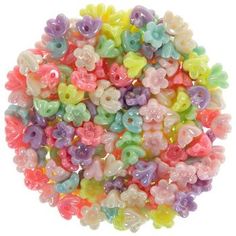 a pile of colorful beads on a white background