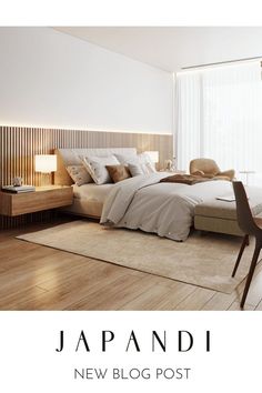 there is a large bed in the room with white walls and wood flooring on it