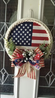 an american flag wreath hangs on the front door