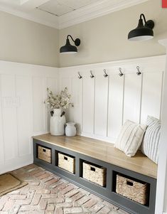 a bench with baskets on it in a room