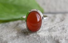 Handmade design ring all ring sizes available >>stone name=natural carnelian >>stone size=13mm length 9mm width 925 silver ring handmade ring (you will get exact item that you see in the photo) the images are not edited all images are genuine. if u any question for item please feel free and contact me. we are very happy to help you. important note------ #we shipped your item 1-3 business days #item delivery time-2-3 weeks. thank you. Oval Carnelian Orange Ring, Oval Orange Carnelian Rings, Orange Oval Carnelian Rings, Oval Carnelian Moonstone Ring For Anniversary, Polished Carnelian Oval Rings, Carnelian Gemstone Rings In Oval Cabochon Shape, Orange Carnelian, Carnelian Ring, Carnelian Stone