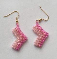 beaded earrings pink beaded earrings ombre pink colours pale to bubblegum chevron shaped arrow shaped unusual girly pink  A pair of beaded earrings in pink. These beaded earrings have an ombre colour change to them, the pink colours change from  pale to bubblegum pink throughout the chevron shaped earrings.  Or they could be direction arrow shaped. You decide! Either way they are unusual and very girly pink Cute Pink Beaded Dangle Earrings, Cute Pink Dangle Beaded Earrings, Cute Pink Beaded Earrings For Gift, Handmade Cute Pink Beaded Earrings, Cute Handmade Pink Beaded Earrings, Cute Pink Handmade Beaded Earrings, Direction Arrow, Pink Beaded Earrings, Ombre Colour