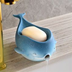 a soap dispenser that is shaped like a whale