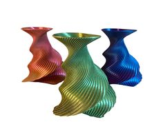 three colorful vases sitting next to each other