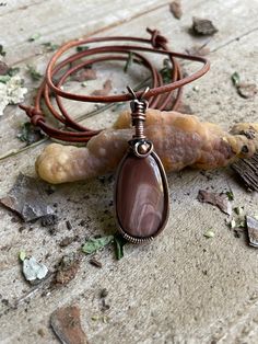 This pendant is made with an imperial, jasper cabochon, wire wrapped with copper and accompanying this pendant will be adjustable leather necklace.  I'm an artist based in South Carolina .I've been creating and selling for about 10 years ,I get a lot of my inspiration from variety of cultures and nature. If you have any questions please feel free to ask. Thank you for visiting!! Wire Wrapped Jasper Necklaces As Gifts, Spiritual Jasper Necklaces With Wire Wrapped, Earthy Jasper Pendant Necklace, Bohemian Jasper Pendant Jewelry, Wire Wrapped Jasper Pendant Necklace, Imperial Jasper, Columbia Sc, Wire Necklace, Copper Pendant