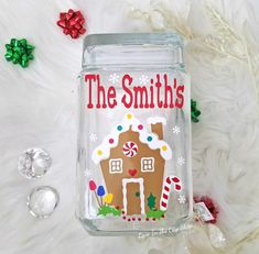 a glass jar with a gingerbread house on it