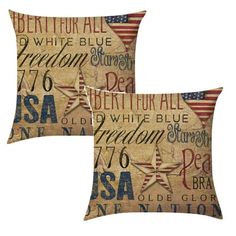 two decorative pillows with the words usa and stars on each pillow cover, both printed in different colors