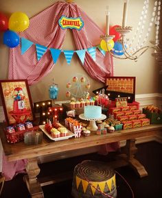 a circus themed birthday party with balloons and cake