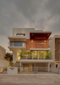 a modern house with stairs leading up to it