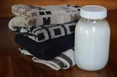 a bottle of milk sitting next to some towels