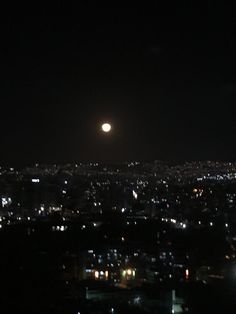 the city lights are lit up in the night sky as seen from an observation point