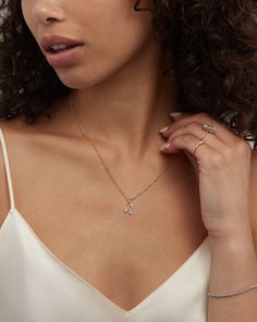 14k solid gold Round, natural diamonds: 16-33 diamonds (varies by letter) Total carat weight: approximately 0.03-0.09 (weight varies by letter) Color: H-I Clarity: SI Pendant dimensions: Length: 10 mm Width: 4 mm-12 mm (varies by letter) Thickness: 1.5 mm Pendant bail dimensions: Height: 6 mm Opening: 3 mm Important to note: This product does not come with a chain. Classic Diamond Jewelry With Si Clarity, Si Clarity Round Cut Diamond Jewelry, Everyday Gold Diamond Initial Necklace, Dainty Diamond White Jewelry With Si Clarity, Classic White Gold Diamond Necklace Si Clarity, Classic White Gold Diamond Necklace With Si Clarity, Classic Diamond Initial Necklace, Yellow Gold Initial Necklace With Diamond, Yellow Gold Diamond Initial Necklace