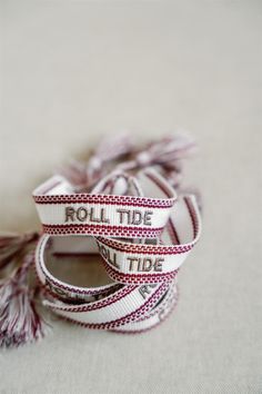 OFFICIALLY LICENSED BY THE UNIVERSITY OF ALABAMA This "Roll Tide" crimson and white bracelet is perfect in the friendship bracelet era! The bracelet has easy adjustable ties and fringe tassels. White Bohemian Personalized Friendship Bracelets, Personalized White Bohemian Friendship Bracelets, Bohemian White Personalized Friendship Bracelets, Adjustable White Bracelet Souvenir, Adjustable White Band Bracelet, White Band Jewelry Gift, The University Of Alabama, White Bracelet, The Friendship