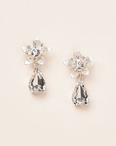 Experience elegance with our Tess Floral Earrings. These exquisite earrings feature a silver flower design that delicately holds a shimmering teardrop crystal. Crystal gemstones Lightweight design Hypoallergenic, lead-free & nickel-free Style #4273 Flower Top, Floral Jewelry, Jewelry Crystal, Discount Jewelry, Free Style, Wedding Jewelry Earrings, Enamel Flower, Floral Jewellery, Crystal Drop