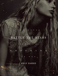 a woman with long blonde hair standing in front of a black and white background that says rattle the stars