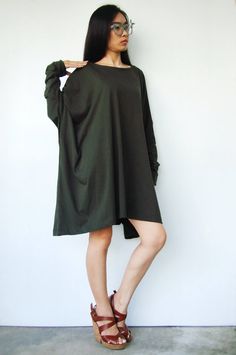 "🚚..ALL ORDERS ARE SHIPPED VIA DHL EXPRESS MAIL Simple and modern, with an air of urban playfulness, this top has boxy, wide cuffed hem sleeves and a scoop neckline; the extra wide body gives you all the comfort without losing an ounce of style! * Pull-on style * Scoop neck * Wide cuffed hem sleeves * Longer at the side hems * Loose silhouette Measurements approximately: Sleeve length: 25\" (63.5 cm) Sleeve cuff: 10\" (25.5 cm) round Bust: 78\" (354 cm) Hips: 84\" (213 cm) Tunic length from sho Fall Lagenlook Crew Neck Tops, Fall Crew Neck Lagenlook Tops, Fall Crew Neck Tops In Lagenlook Style, Baggy Crew Neck Tops For Fall, Slouchy Cotton Batwing Sleeve Tops, Cotton Lagenlook Top With Relaxed Fit, Long Sleeve Lagenlook Top, Trendy Baggy Tops For Fall, Trendy Long Sleeve Baggy Tops