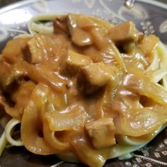 pasta with meat and sauce on a plate