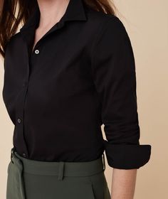 Wrinkle-resistant shirts are stylish essentials for every woman's wardrobe. Our Bella shirt's slimming darts give it a precise fit, and its stretch cotton fabric gives you added comfort. Plus, our Perfect Placement Buttons ensure your shirt always stays closed—with no awkward gaps. In crisp black, this version goes well under a blazer or light jacket. FEATURES: Buttoned cuffs SKU #40190Bla FABRIC: 65.5% cotton, 30% polyester, 4.5% elastane Stretch Cotton Fabric, White Shirts Women, Iron Shirt, Shirts Women, Women's Wardrobe, White Shirts, Light Jacket, Wrinkle Free, Black Stretch