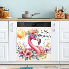 a pink flamingo with flowers on its head is standing in the kitchen