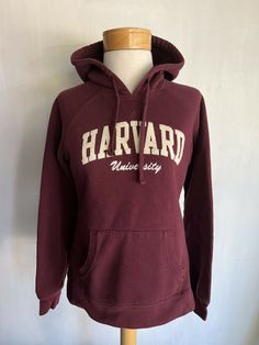 HARVARD UNIVERSITY Official Women's Embroidered Champion Athletic Hoodie Medium YOU GET THE ACTUAL ITEM SHOWN IN THE PHOTO!!! (SEE MEASUREMENTS BELOW) PIT TO PIT - 18.5" LENGTH - 23" I had a bunch of left over inventory from my old vintage tee shirt store in Los Angeles called Lemon Rags -  lemon rags(dot)com.  This is one of the items taken out of storage recently.  UNLESS NOTED ABOVE IN BOLD RED all these shirts are used (unless listed as new) and could have some signs of wear but do not have Varsity Style Cotton Hoodie For Campus, Collegiate Cotton Hoodie For Campus, Varsity Hoodie For Campus, Collegiate Hooded Hoodie For Campus, Varsity Hooded Hoodie For Campus, Havard Shirt, Harvard Hoodie Aesthetic, Harvard University Logo, Collegiate Cotton Hoodie With Kangaroo Pocket