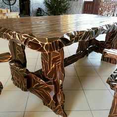 a wooden table sitting on top of a tiled floor