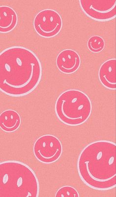 a pink background with smiley faces on it