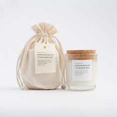 the lemongrass candle is next to a bag