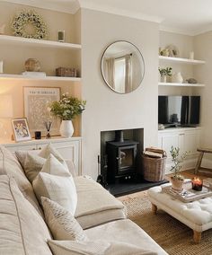 a living room filled with furniture and a fire place