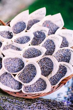 a basket filled with lavender seeds on top of a table